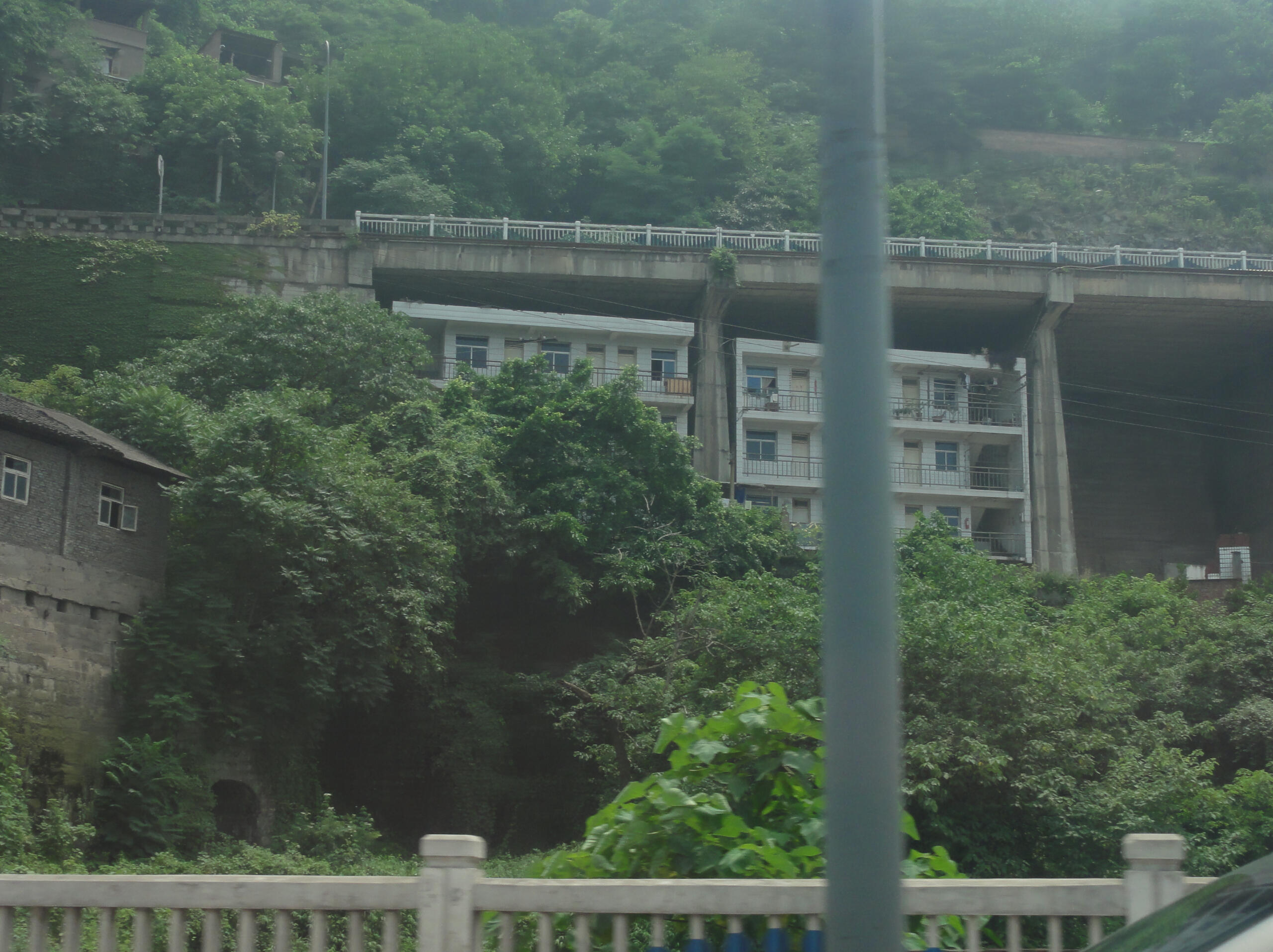 There is always concrete: methodical blocks and things far too heavy to lift up– and the stony voice crackles from the speakers, a layer of dust rejoicing in its last swirl through the air as I step off the train, into a land without movement.